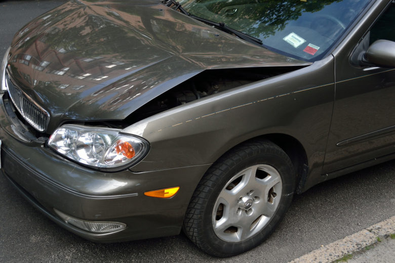 Auto Dent Repair on a grey sedan in Plano