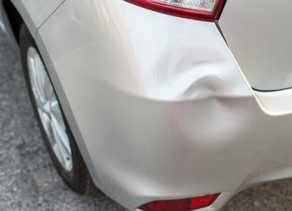 Vehicle Dent before a Paintless Dent Removal in Plano, Dallas, Farmers Branch, McKinney & Surrounding Areas 